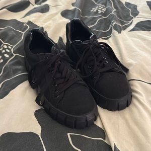 Black fabric shoes with a rubber platform sole